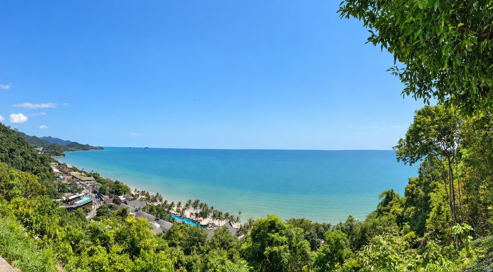 Koh Chang coastline and forested hills above the beach